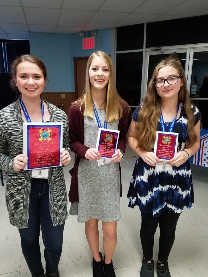 Abbey McCord, Makinley Bonesteel, and Katie Lanham with their plaques. 