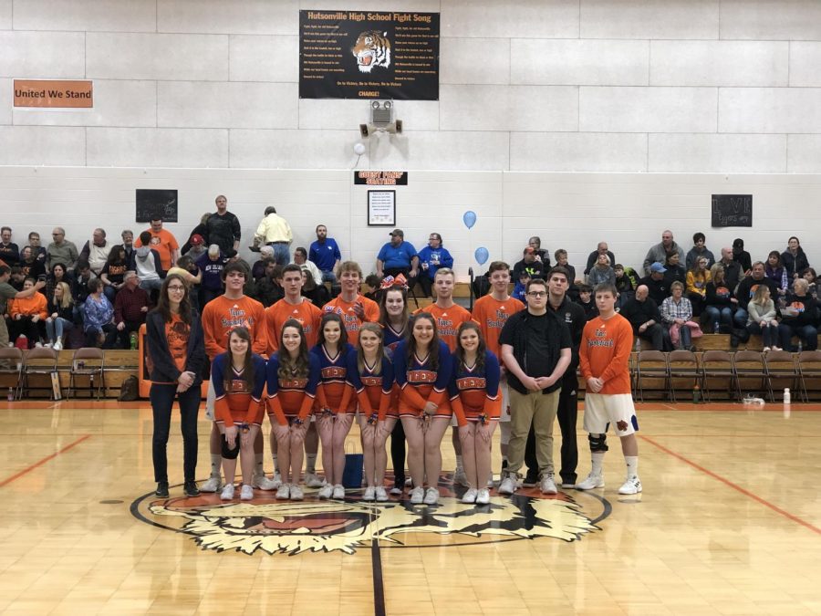 Seniors pose for a picture after being recognized during Senior Night.