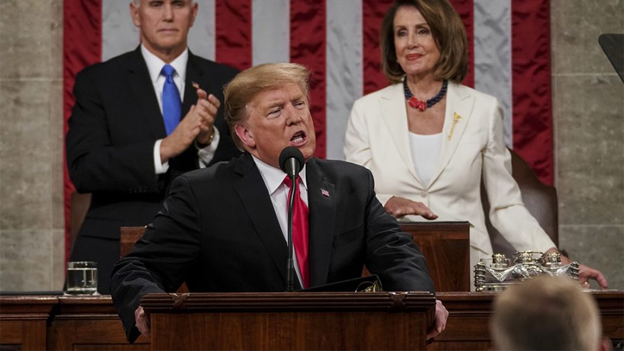 President Donald Trump gives his State of the Union address to a joint session of Congress, Tuesday, Feb. 5, 2019 at the Capitol in Washington, as Vice President Mike Pence, left, and House Speaker Nancy Pelosi look on. (Doug Mills/The New York Times via AP, Pool)