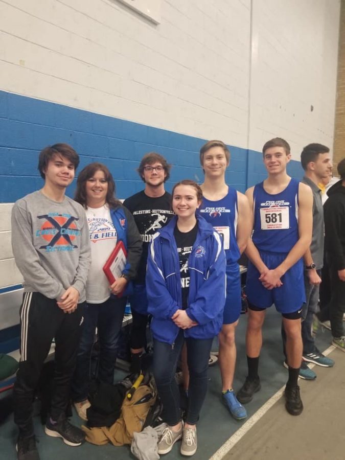 Nathan More, Coach Ogle, Blaze Dedrick, Abbey McCord, Nick Booth, and Chase Knoblett at the track meet. 