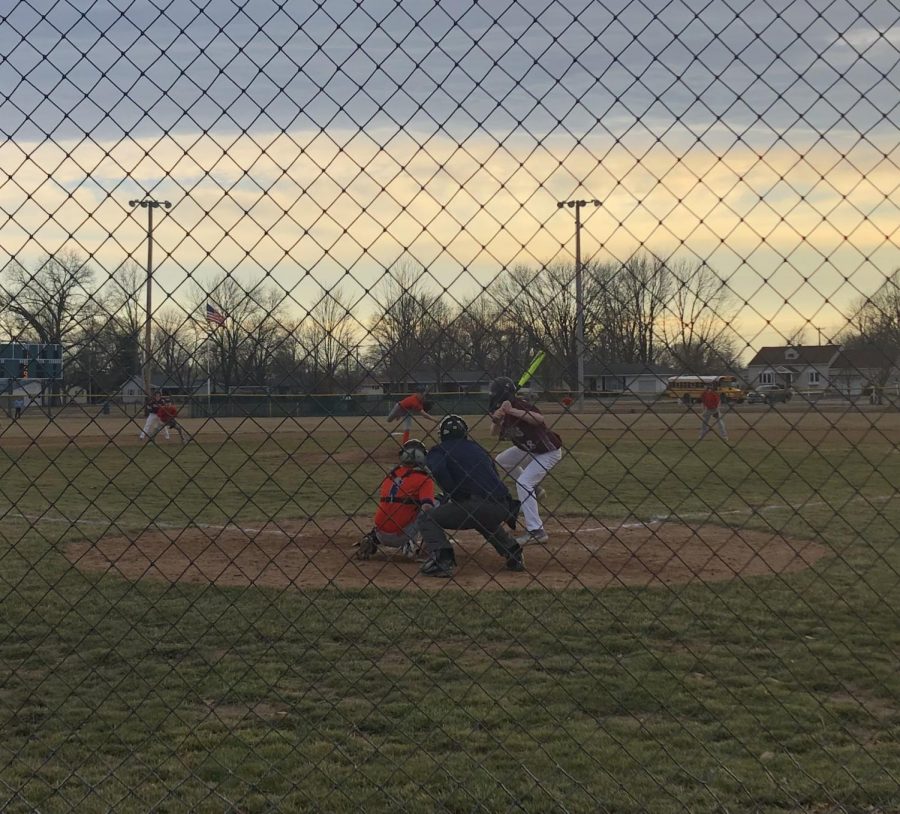 PHS Junior Levi Beard catches as HHS Junior Evan Newlin pitches during Wednesday nights baseball game against Robinson.