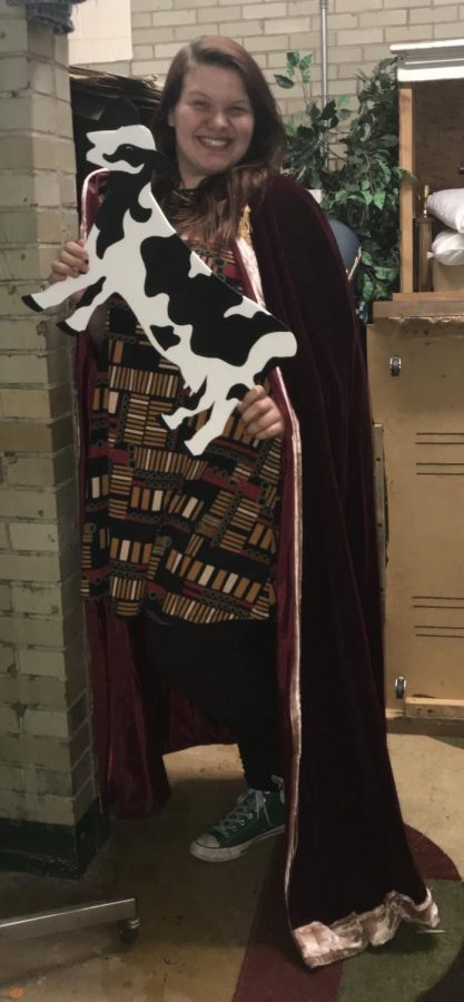POSE! Summer Agan strikes a pose in her prop room attire. Summer has been in Drama Club all four years of high school and has been a lead role in almost all of the plays. Oh yes give me the cow, it will be perfect with the robe -Summer said.