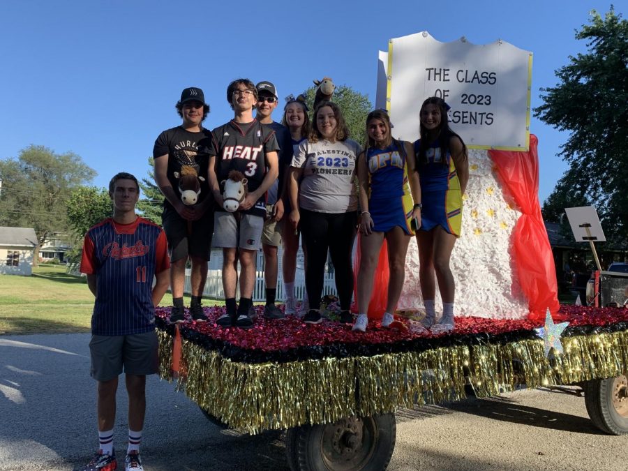 Juniors stand aboard their junior class float.  The float received first place in the Homecoming float competition.