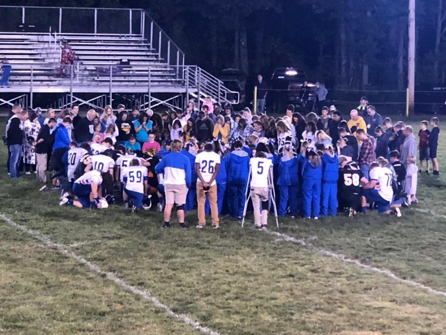 OPH and Dugger coming together at the end of the game for a prayer. 