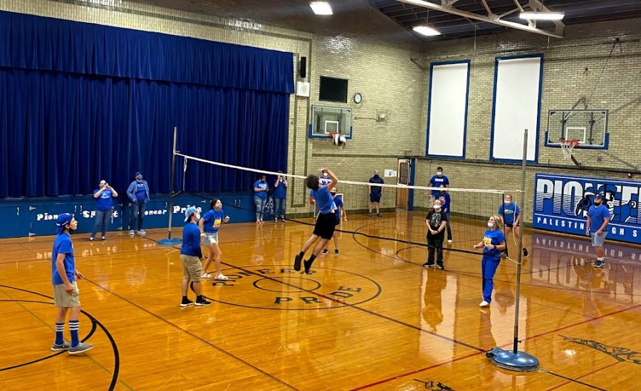 Junior Elliot Meadows is going up for the spike during HOCO volleyball.  The juniors beat the freshman during that game.