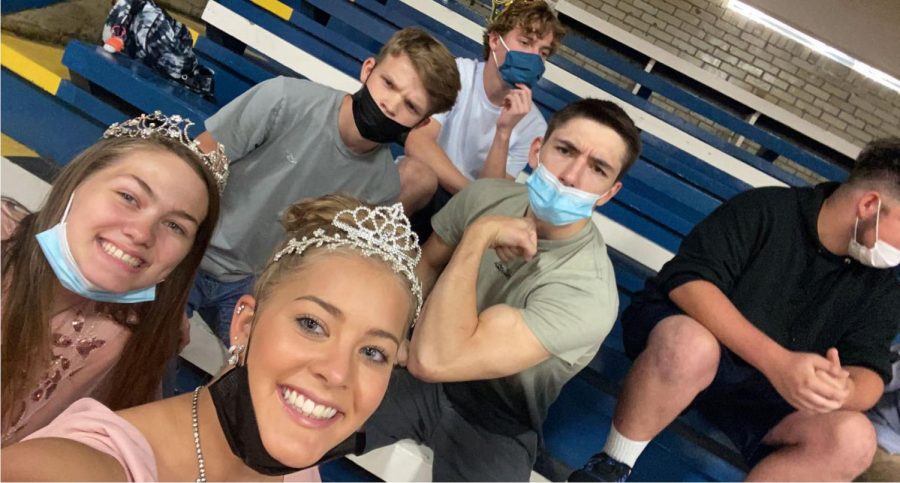 Seniors Krescene Holscher, Makinley Bonesteel, Wesley Adams, Tyler Dennison, and Rider Lawhorn pose for the camera while watching the HOCO games during WIN on Monday.  The boys were not amused by all of the pictures that were being taken.