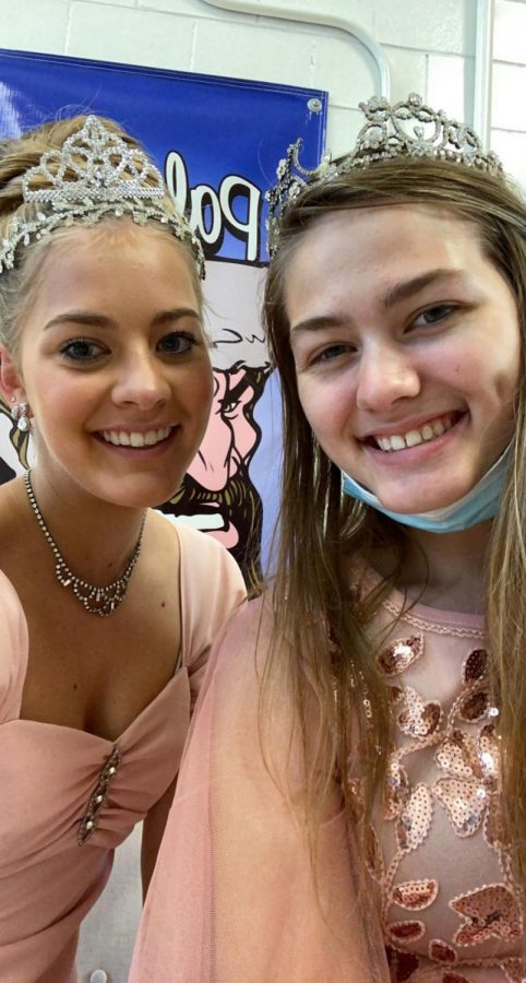 Krescene Holscher and Makinley Bonesteel are princesses for the day on HOCO Royalty day.  The two of them coincidentally matched in their pink gowns.