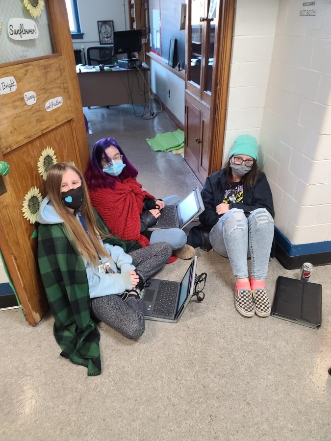 Kieran Jenkins, Katie Lanham, and Shyan Dunlap working hard. They were forced to follow the heat source to the hallway. 