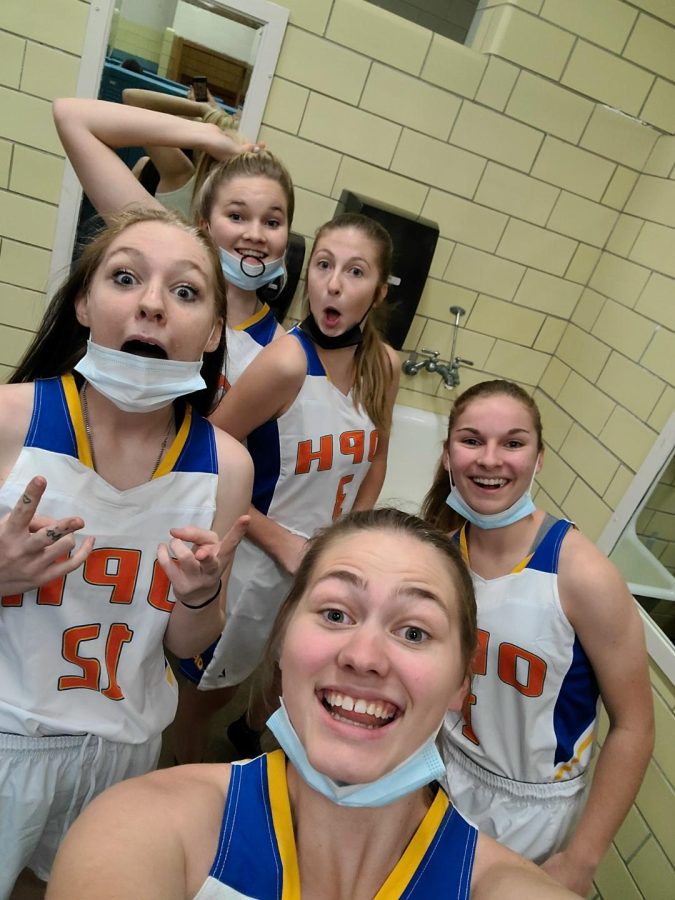 OPH girls getting in their pre-game hype in the locker room. The first-ever OPH Basketball game ended in a great victory. 