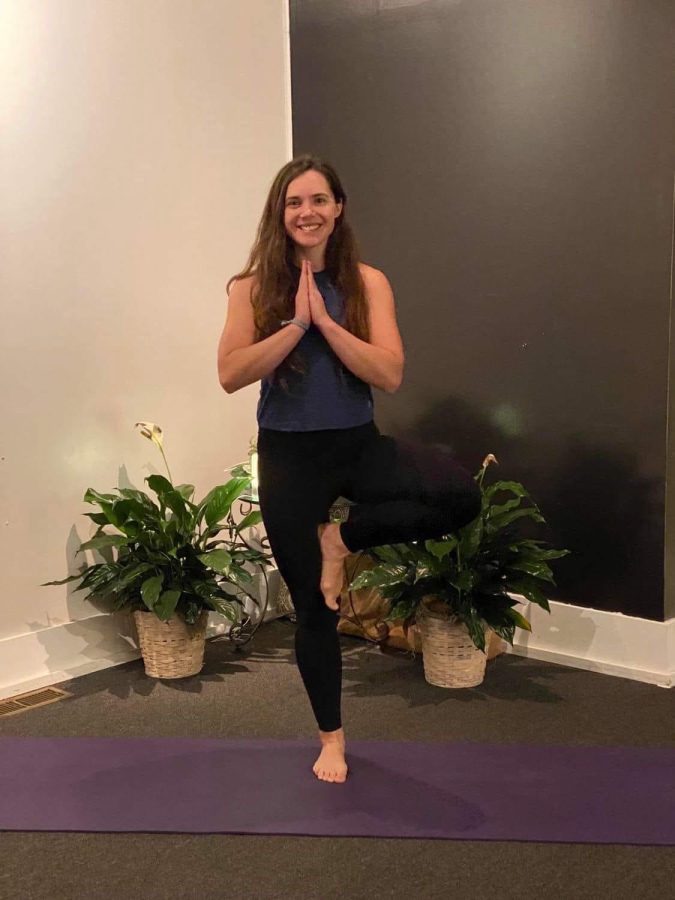 Susannah preforms the tree pose to show off her yoga skills.