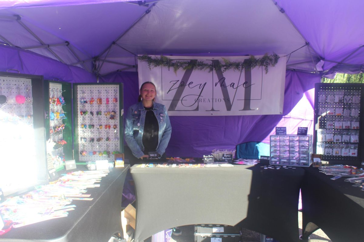A PHS student, Zoey, at her booth at the festival. 