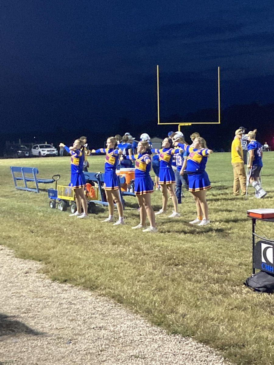 The JV cheer team cheering at the last JV game!