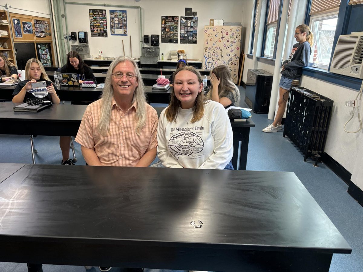 Zoey and Mr. Smith in her seat from sophomore year