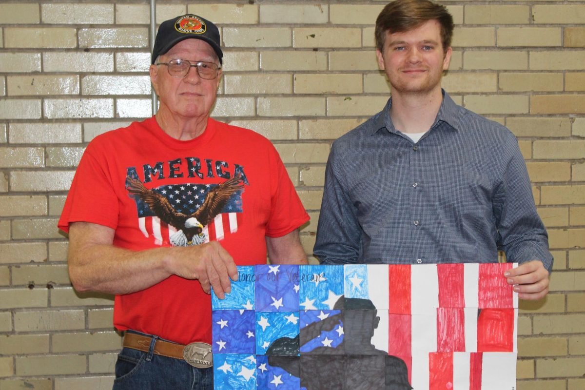 Mr. Plew and his grandfather, Dwight Piper, the guest speaker at the Veteran's Day assembly.