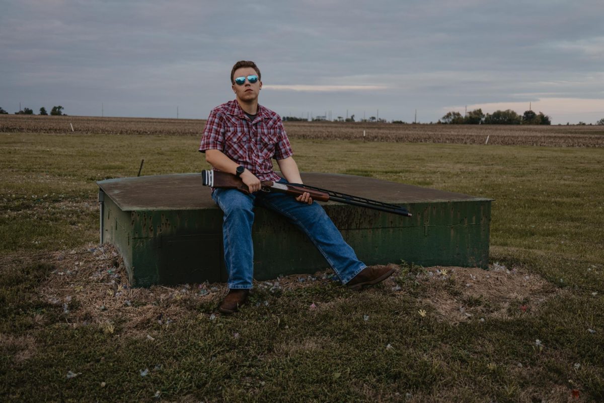 Shawn posing for Senior picture