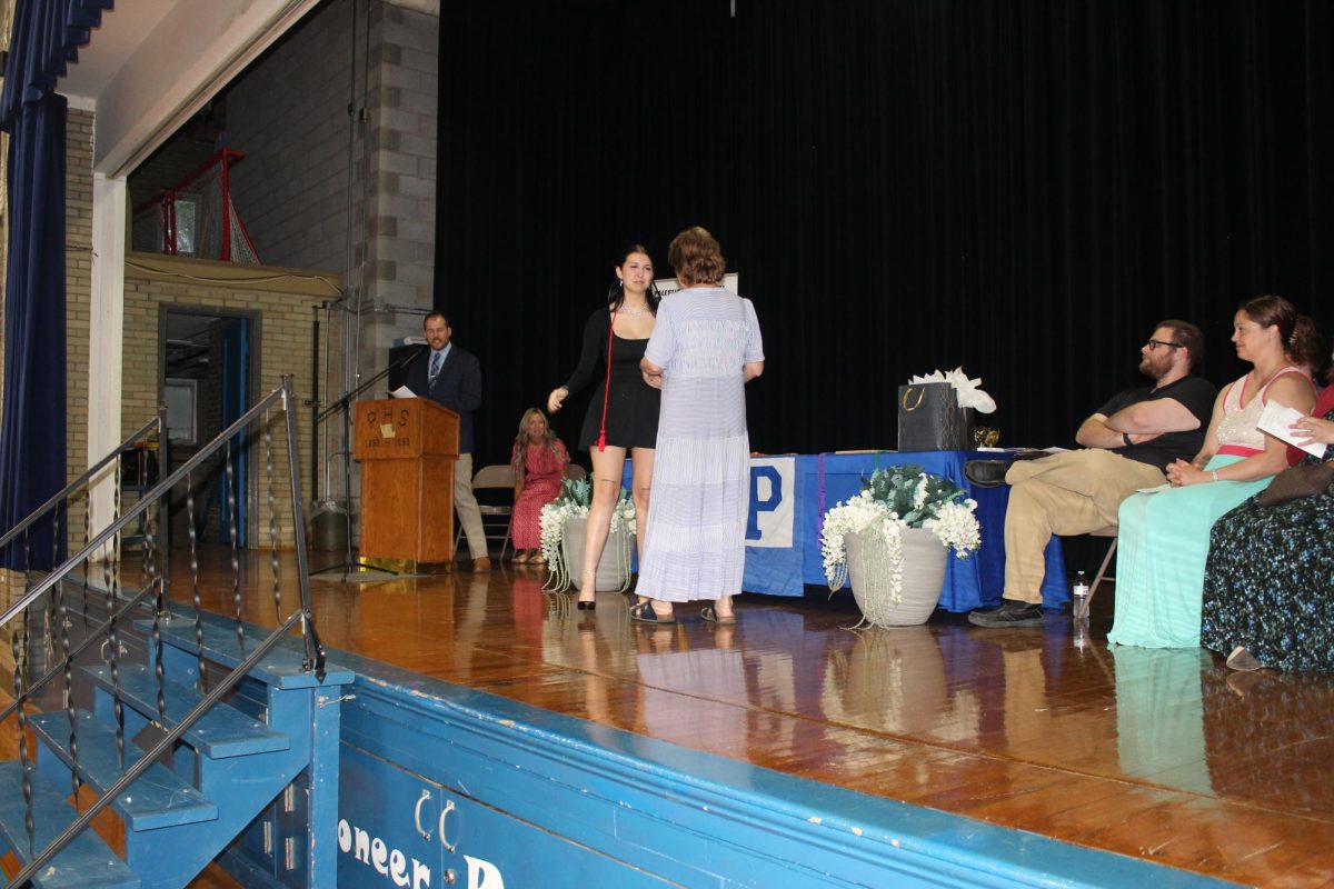 Natalie Yargus giving Mrs. Hyde her award