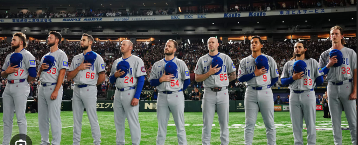 The Cubs lineup standing for the National Anthem before the game.